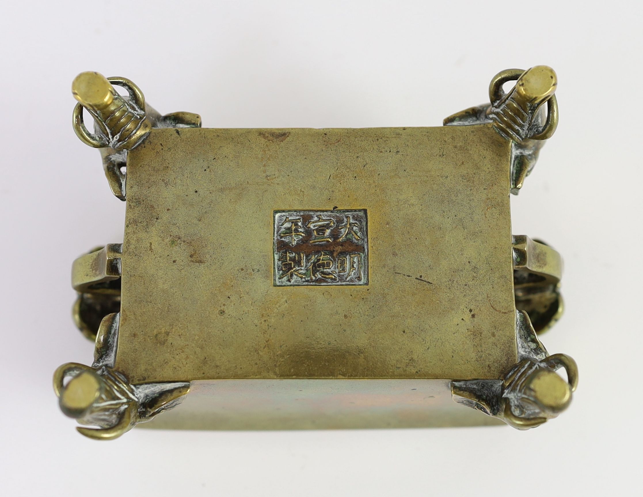 A Chinese polished bronze censer, fangding, Xuande mark, 19th century, 13.5cm wide